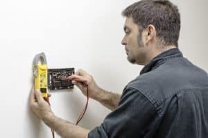 Thermostat check by hvac specialist