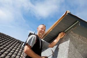 man safely working on a roof