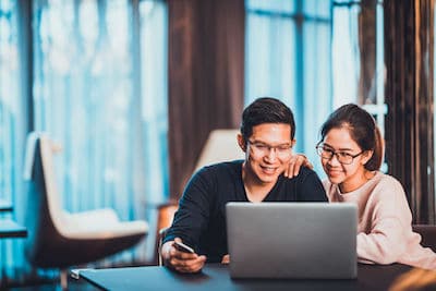 couple reviewing fence companies other services