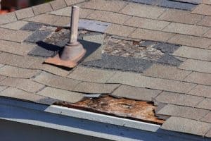 damaged roof with missing shingles and leaks