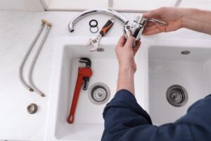 installing low flow faucet to Make Your House More Eco-Friendly With Sustainable Home Renovations